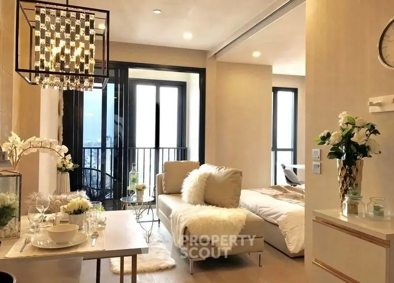 Luxurious open-plan living room with elegant decor and city view balcony.