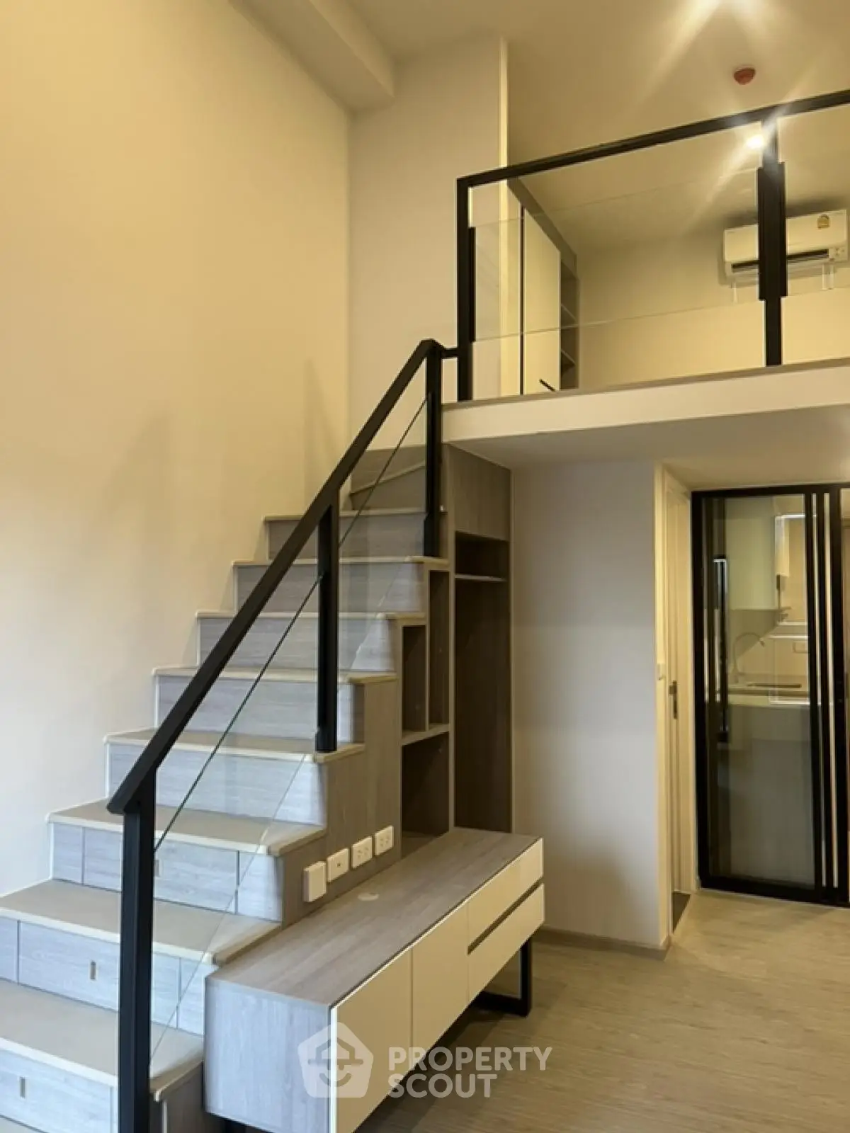 Modern loft apartment with stylish staircase and mezzanine level