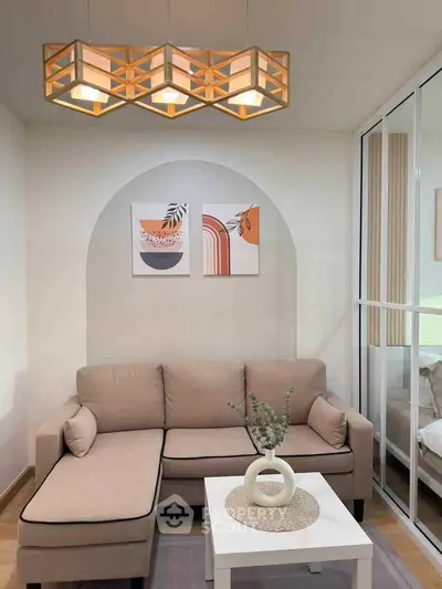 Stylish living room with modern decor and cozy beige sofa in a bright apartment.