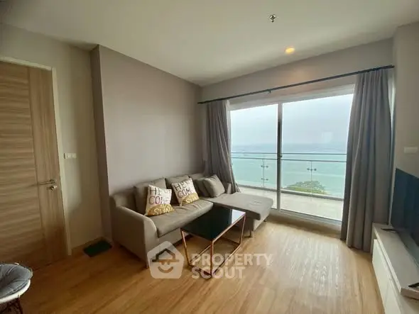 Modern living room with ocean view and cozy seating area