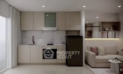 Modern open-layout kitchen and living room with sleek design and neutral tones.