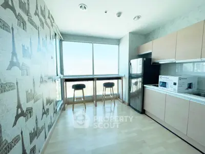 Modern kitchen with Eiffel Tower wallpaper and panoramic city view