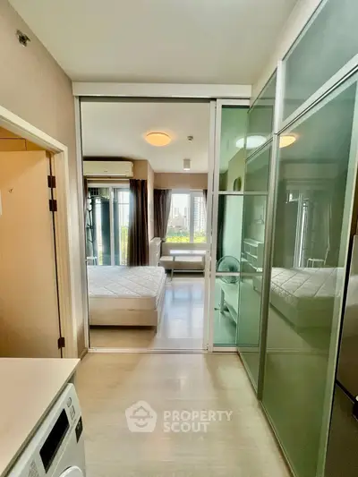 Modern apartment interior with glass partitions and city view