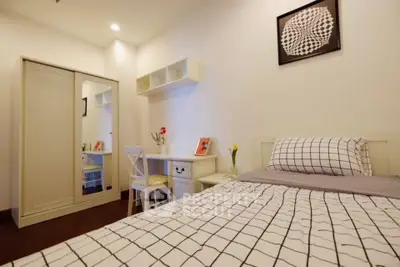Cozy bedroom with modern decor and ample storage space