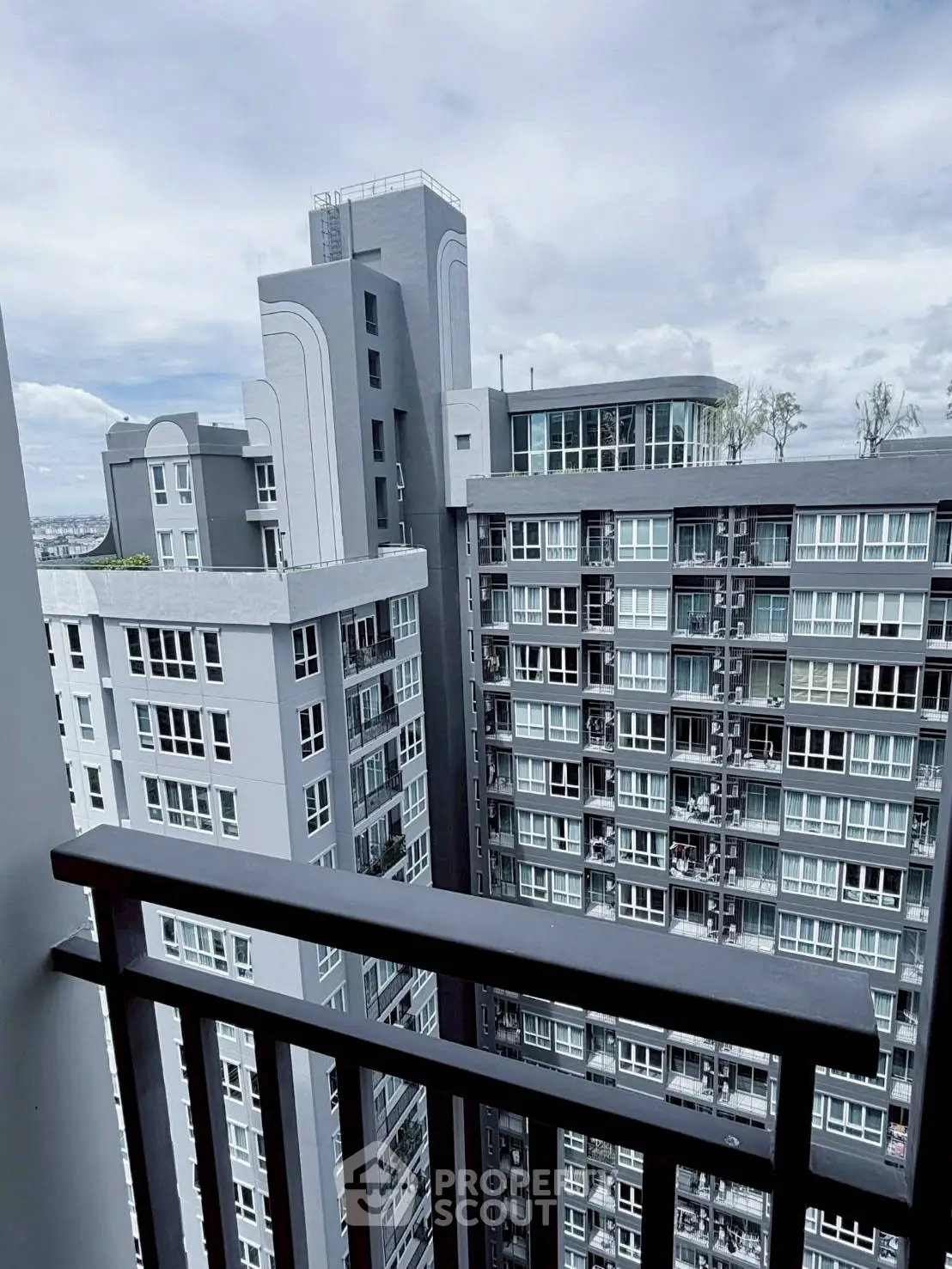 Modern high-rise apartment building with balcony view