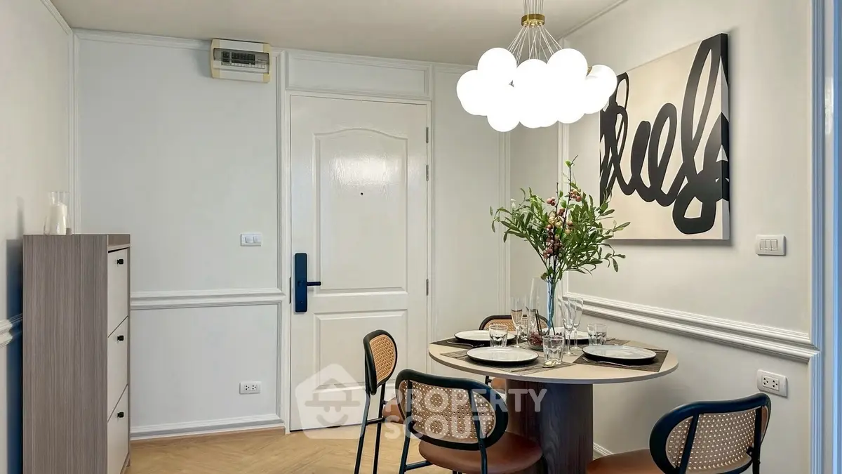 Chic dining area with modern decor and elegant lighting in a stylish apartment.