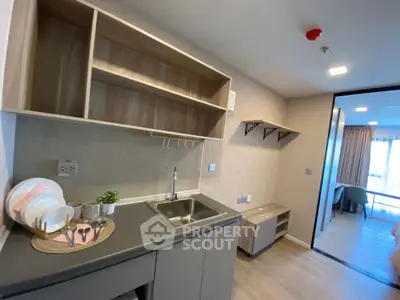 Modern kitchen with open shelving and sleek design in a stylish apartment