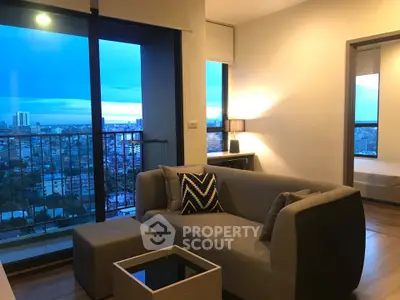 Modern living room with stunning city view and cozy furniture