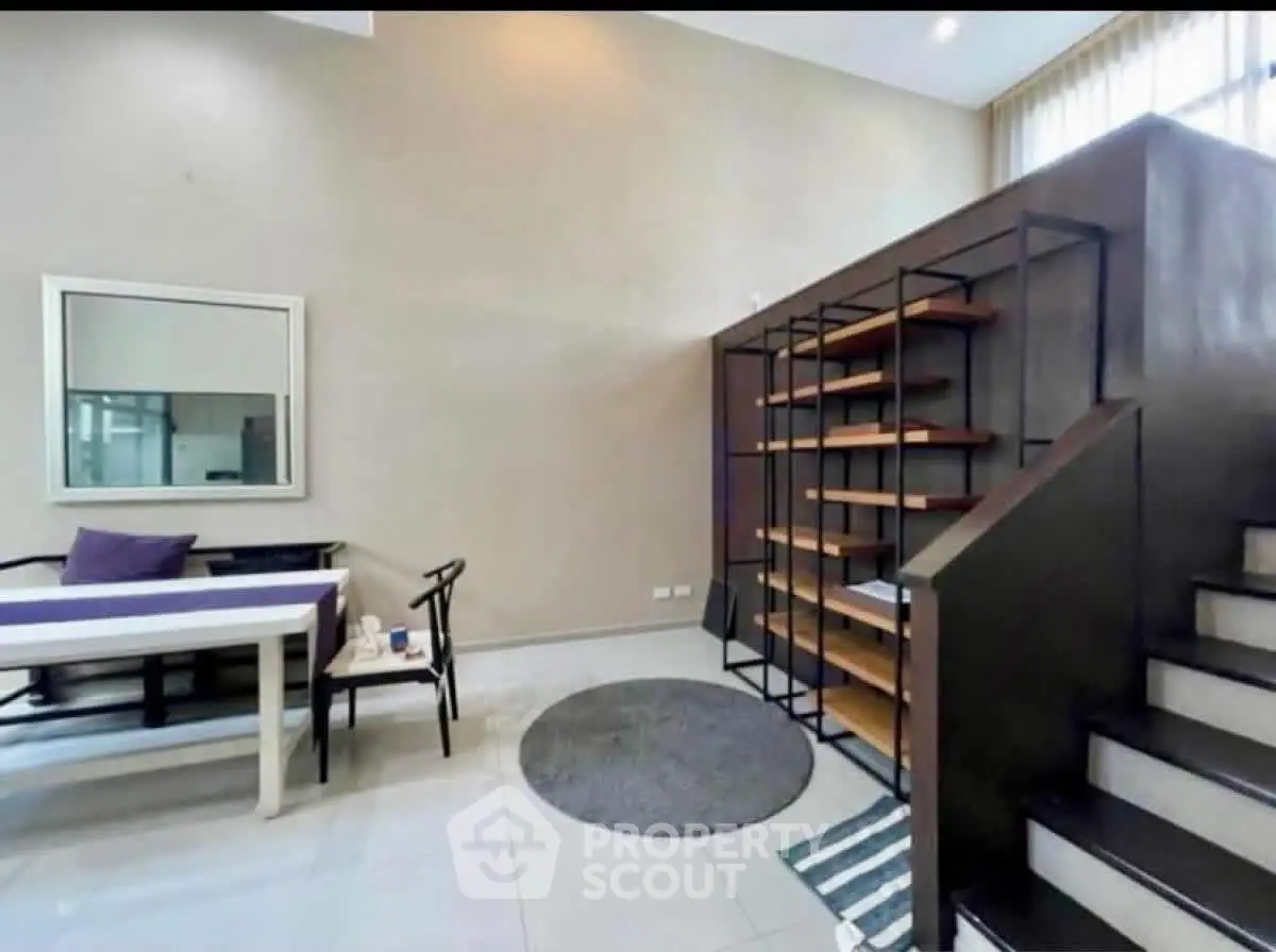 Modern living room with high ceiling and stylish shelving unit
