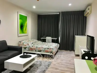 Modern studio apartment with cozy living area and stylish decor