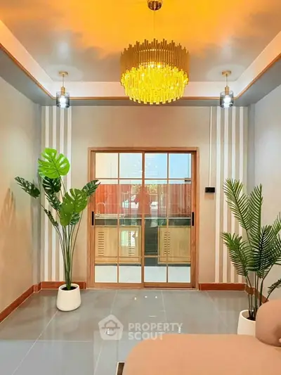 Elegant living room with modern chandelier and stylish decor