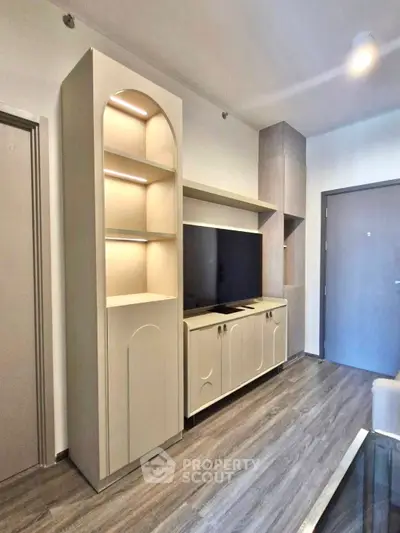 Modern living room with sleek built-in TV cabinet and stylish shelving