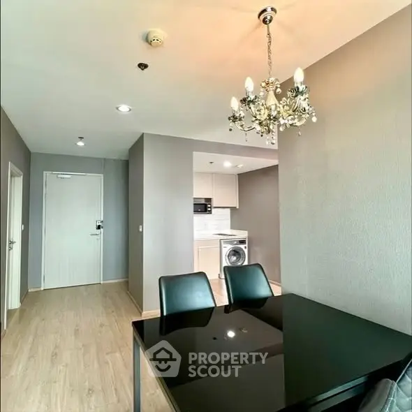 Modern apartment interior with dining area and kitchen appliances