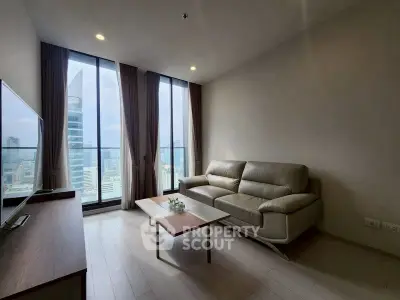 Modern living room with stunning city view and sleek furniture.