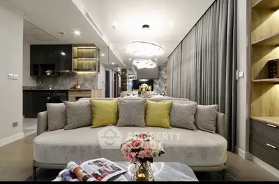 Luxurious modern living room with elegant decor and open kitchen layout