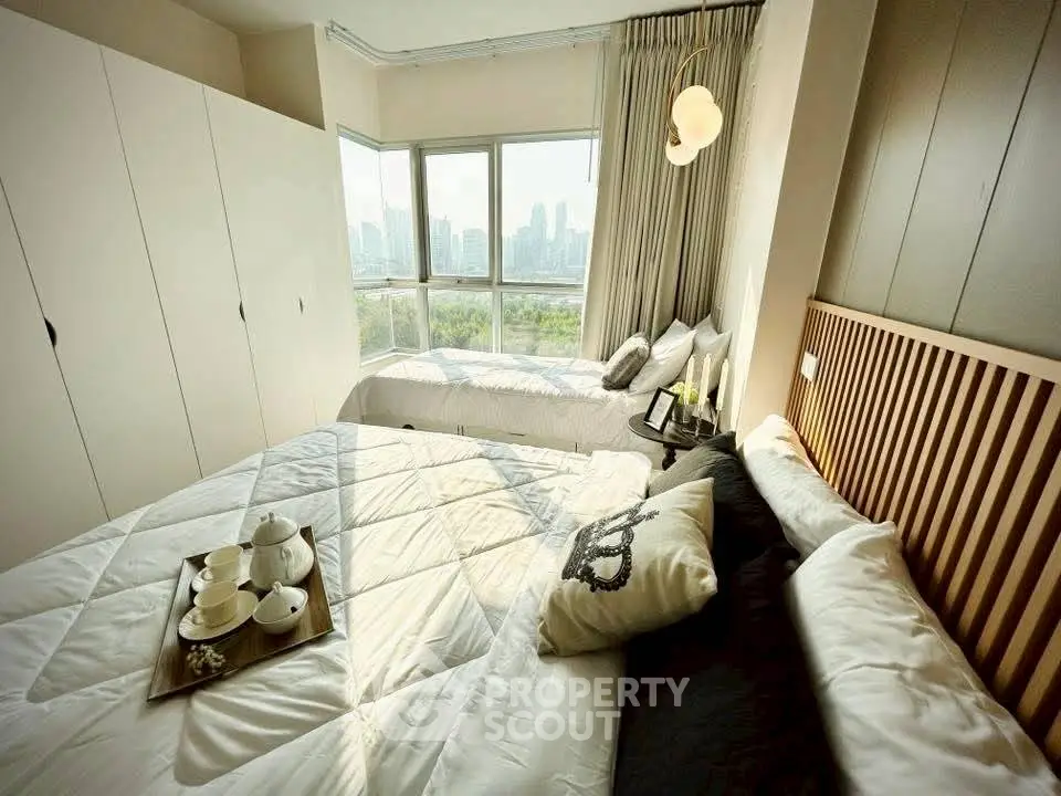 Luxurious bedroom with panoramic city view and elegant decor