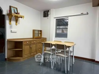 Cozy dining area with wooden furniture and natural light