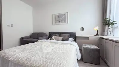 Cozy modern bedroom with plush bedding and stylish decor