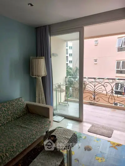 Charming living room with balcony access in modern apartment