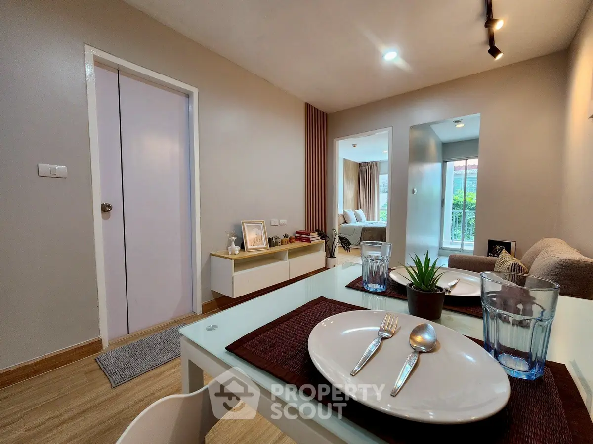 Modern living room with dining area and balcony view