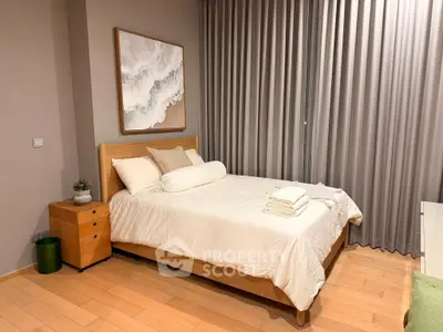 Cozy bedroom with elegant decor and soft lighting, featuring a comfortable bed and stylish curtains.