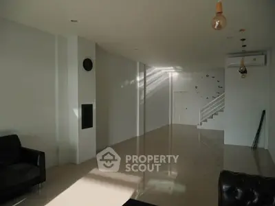 Spacious modern living room with sleek flooring and minimalist decor
