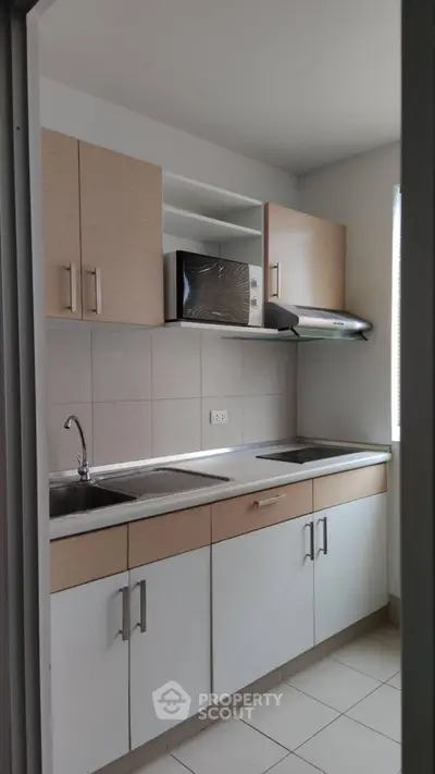 Modern kitchen with sleek cabinets and stainless steel sink
