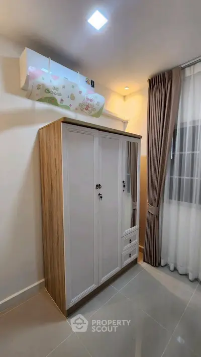 Modern bedroom with stylish wardrobe and elegant curtains