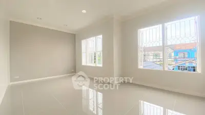 Bright and spacious empty room with large windows and glossy tiled floor, perfect for customization.