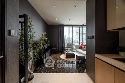 Modern living room with city view, stylish decor, and cozy seating area.