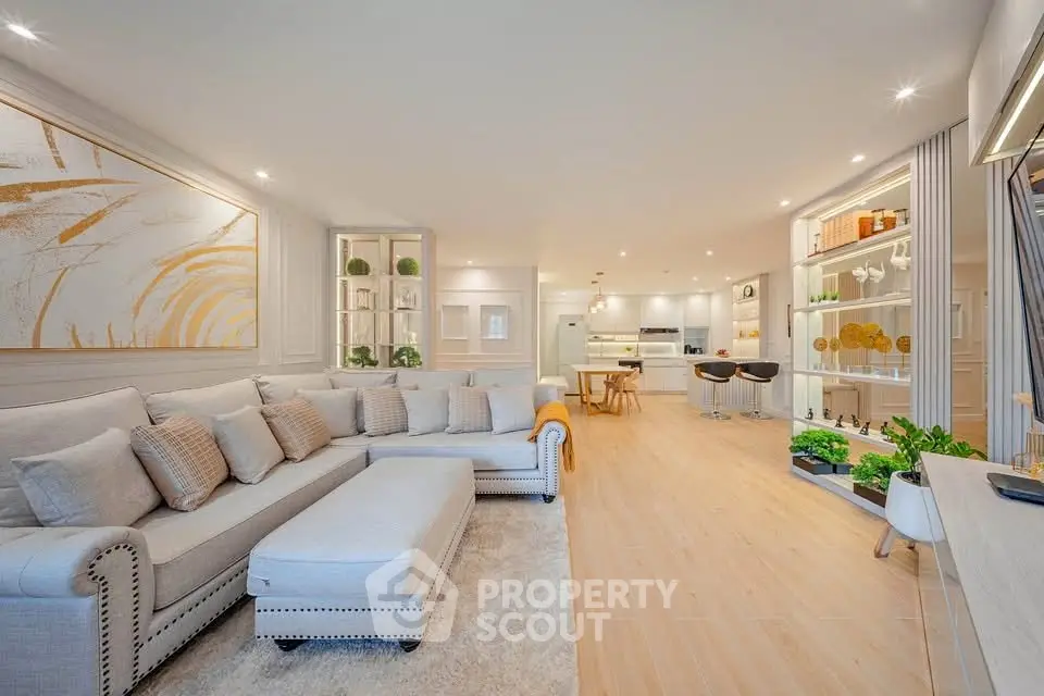 Spacious modern living room with elegant decor and open kitchen layout
