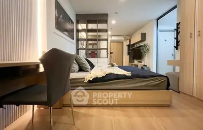 Modern bedroom with stylish decor and wooden flooring