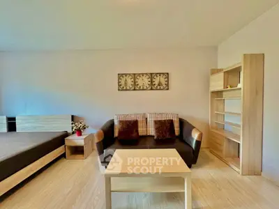 Modern living room with stylish furniture and wooden accents