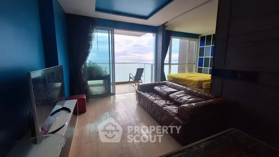Stunning ocean view from modern living room with balcony access