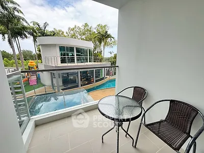 Modern balcony with pool view and stylish outdoor seating