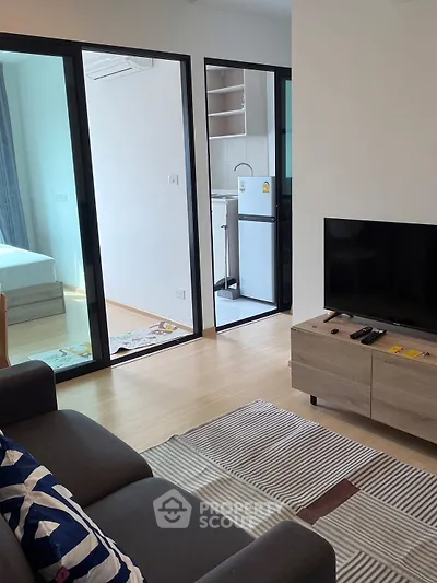 Modern apartment interior with cozy living room and open kitchen layout