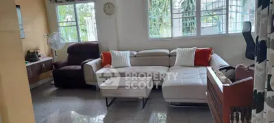 Spacious living room with modern sectional sofa and natural light