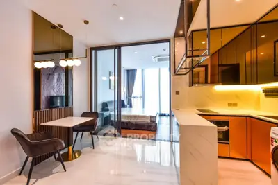 Modern open-plan kitchen with sleek design and integrated appliances in luxury apartment.