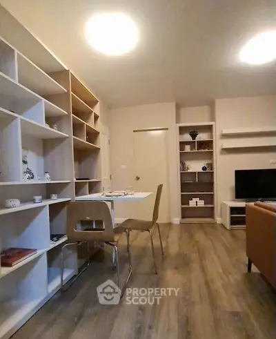 Modern living room with stylish shelving and cozy dining area