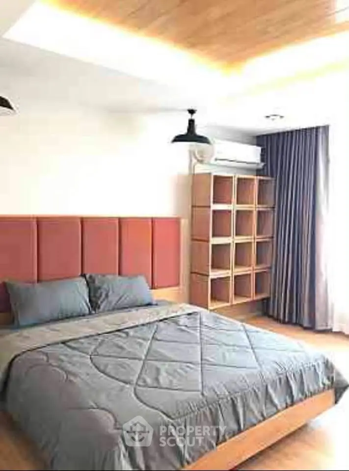 Modern bedroom with stylish decor and ample natural light
