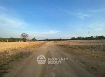 Expansive land plot with clear skies, perfect for development opportunities.
