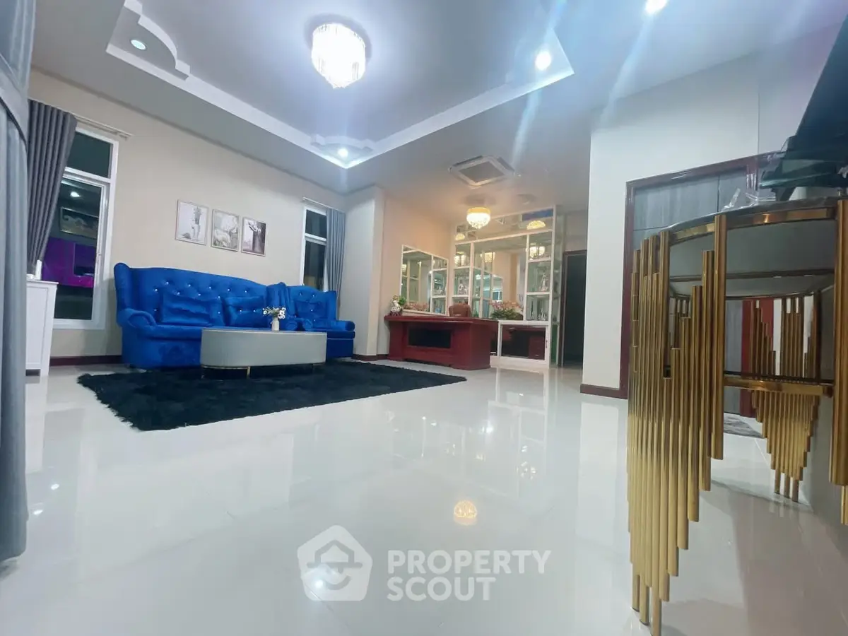 Luxurious living room with elegant blue sofa and modern decor