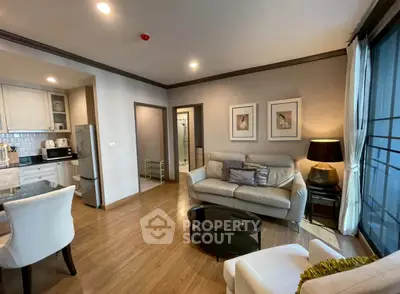 Spacious modern living room with elegant decor and open kitchen layout