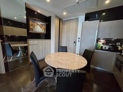 Modern dining area with sleek black chairs and marble table in stylish apartment