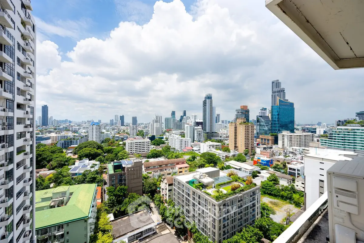 Stunning cityscape view from high-rise balcony in vibrant urban area