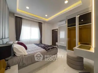 Modern bedroom with sleek design and ambient lighting