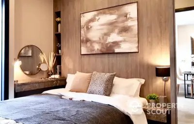 Elegant bedroom with a plush king-sized bed, modern art, and tasteful decor, exuding a serene and luxurious ambiance perfect for relaxation.