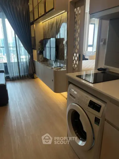 Modern apartment interior with washing machine and stylish living area