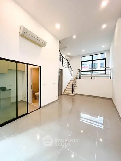 Spacious modern living room with high ceilings and sleek design