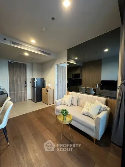 Modern living room with stylish decor and open kitchen layout